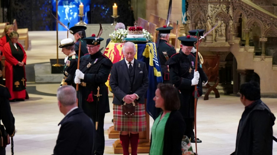 Royals stage vigil as mourners stream by queen's coffin