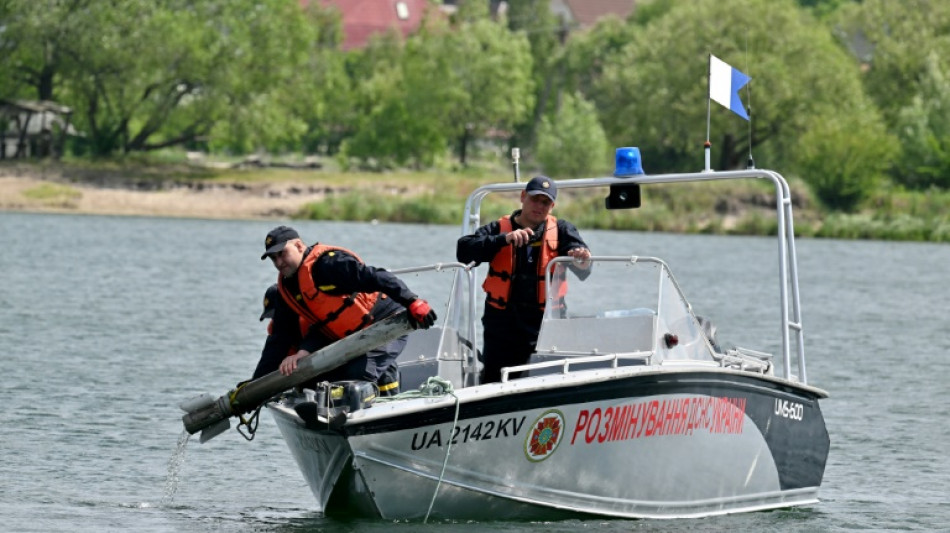 Deminers race to clear lake favoured by bathers near Kyiv