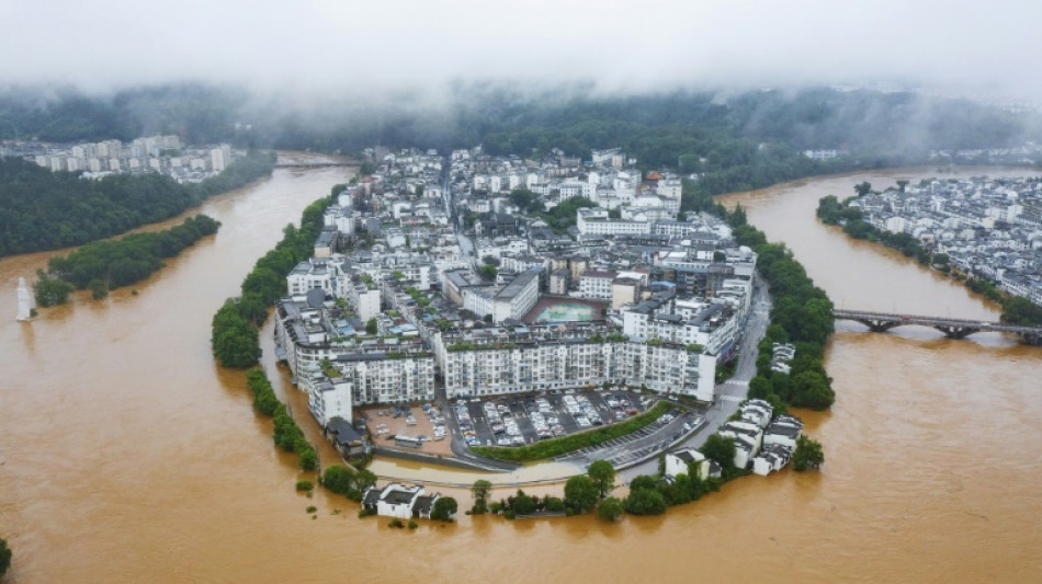 Hundreds of thousands evacuated in China after heaviest rains in decades