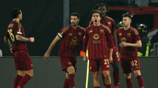 Roma reach Europa League last 16 as 10-man Ajax scrape through